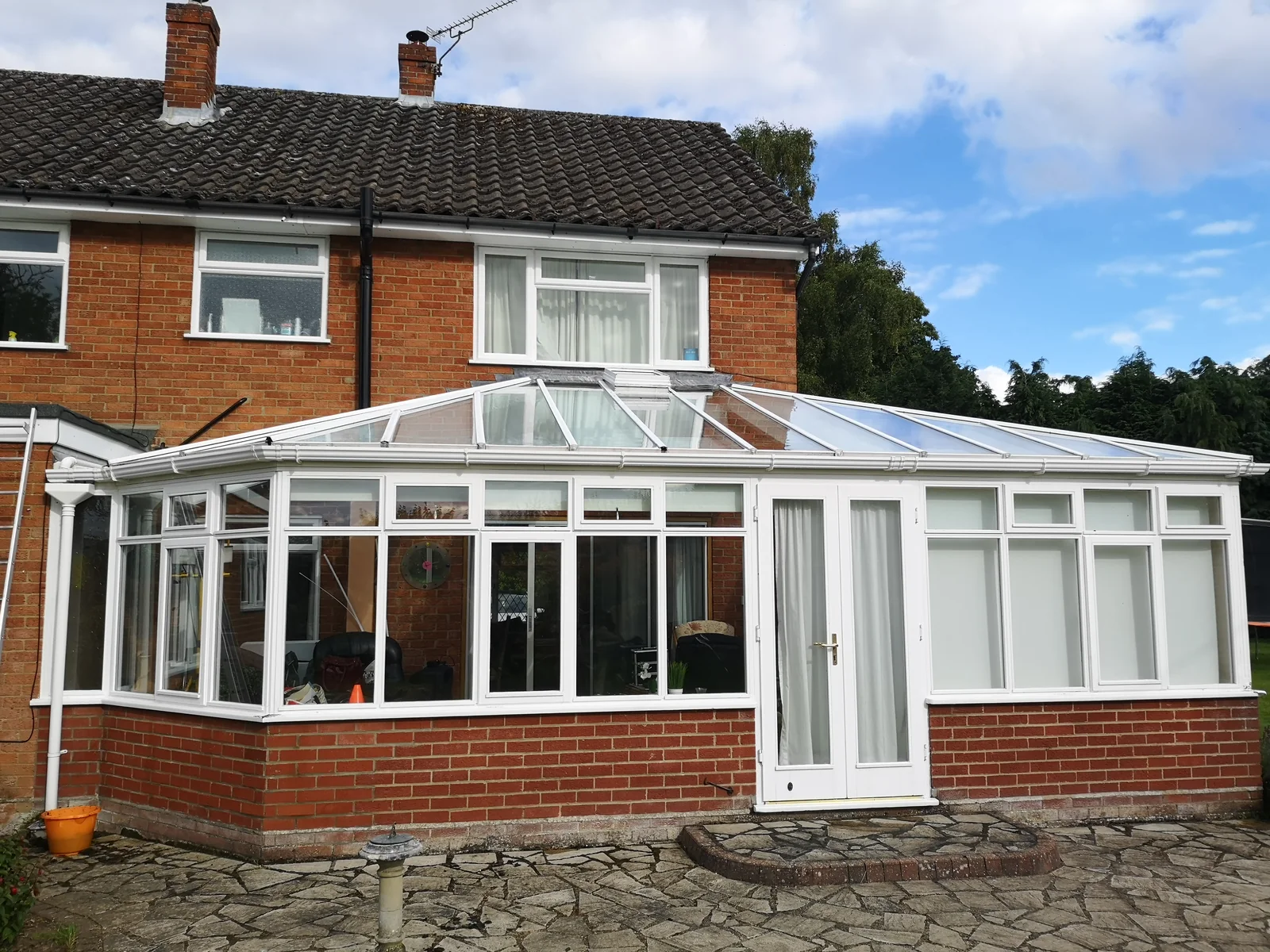 White-framed glass conservatory after cleaning, from our own work